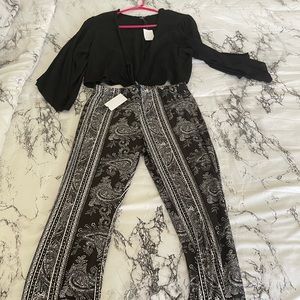 Medium black tie front crop top with large palazzo pants.